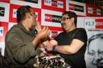 Abhijeet and Kumar Shanu feed each cake which was cut on the occassion of R D Burman_s birth anniversary at 92.7 Big FM in Mumbai, June 27, 2011.JPG